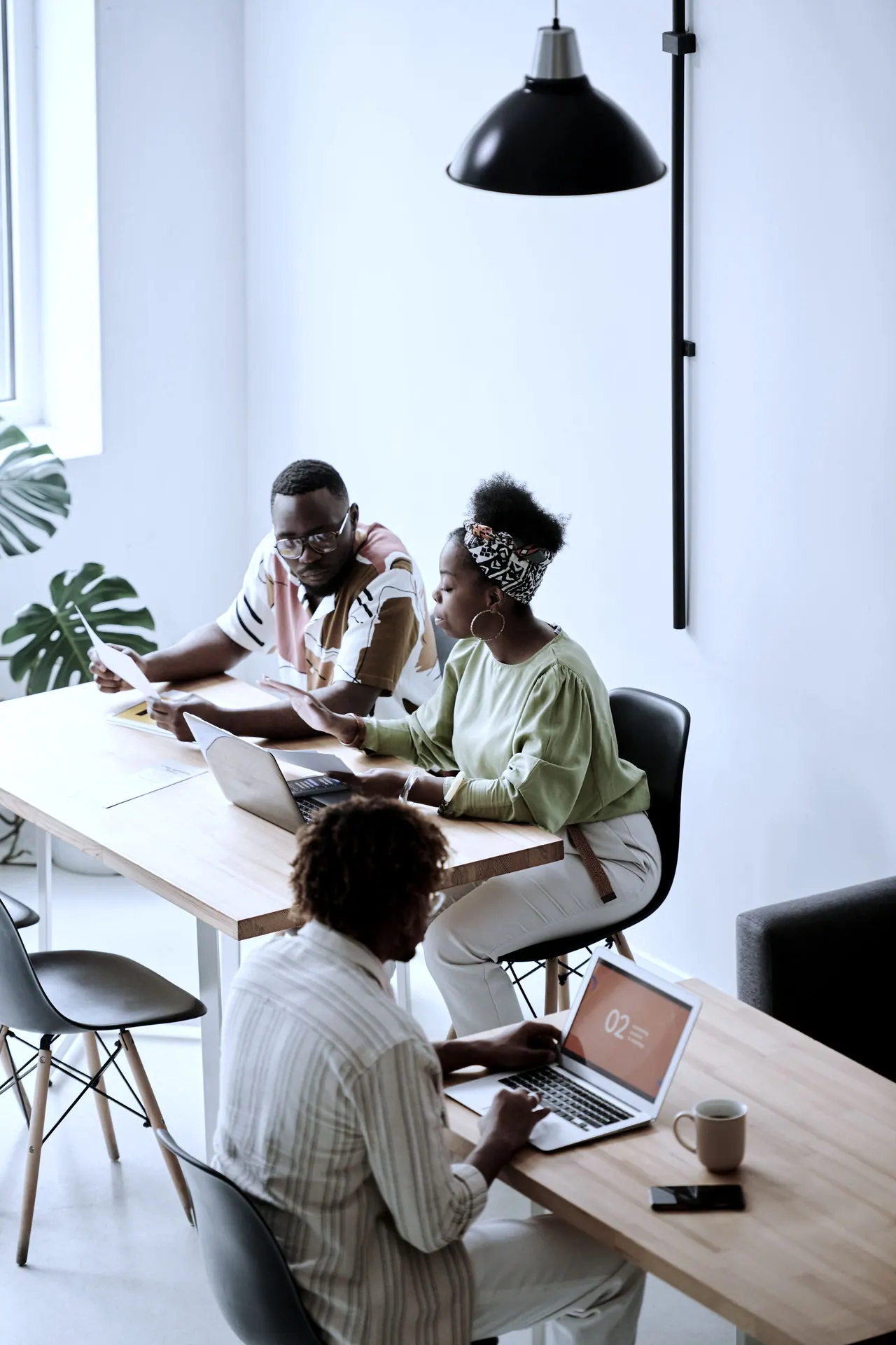 A small team working together around a table